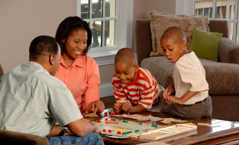 Family playing a board game